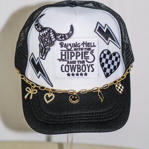 Black and white "Raisin hell" trucker hat with hat jewelry